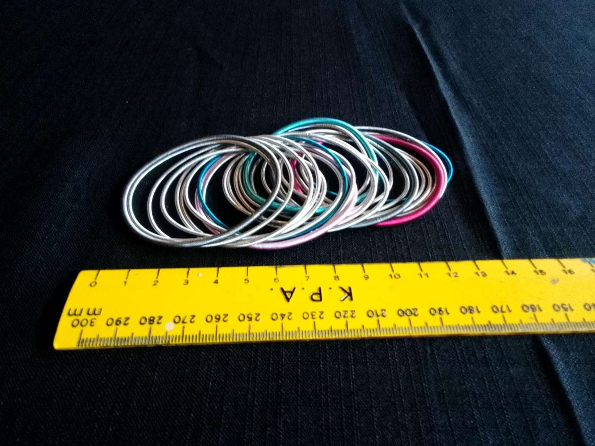Stunning TwentyFive Silver, Pink And Blue Metal Slinky Spring Arm Bracelets   - Excellent Condition