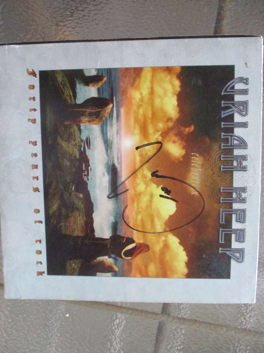 Uriah heep cd and seven single autographed by Mick box
