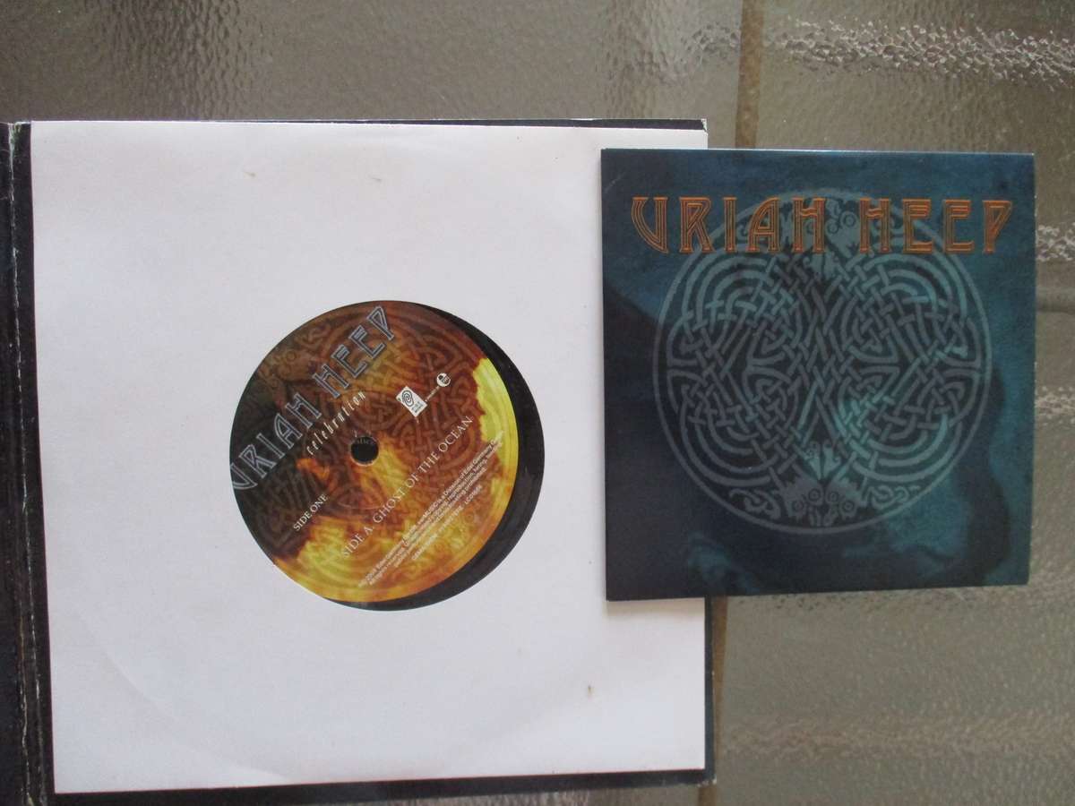 Uriah heep cd and seven single autographed by Mick box