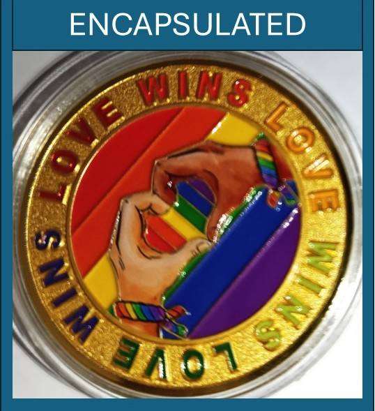Human Rights day - 21 Mar: Encapsulated Love and Pride Medallion in transparent display case.