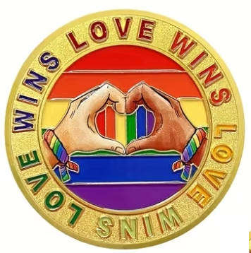 Human Rights day - 21 Mar: Encapsulated Love and Pride Medallion in transparent display case.