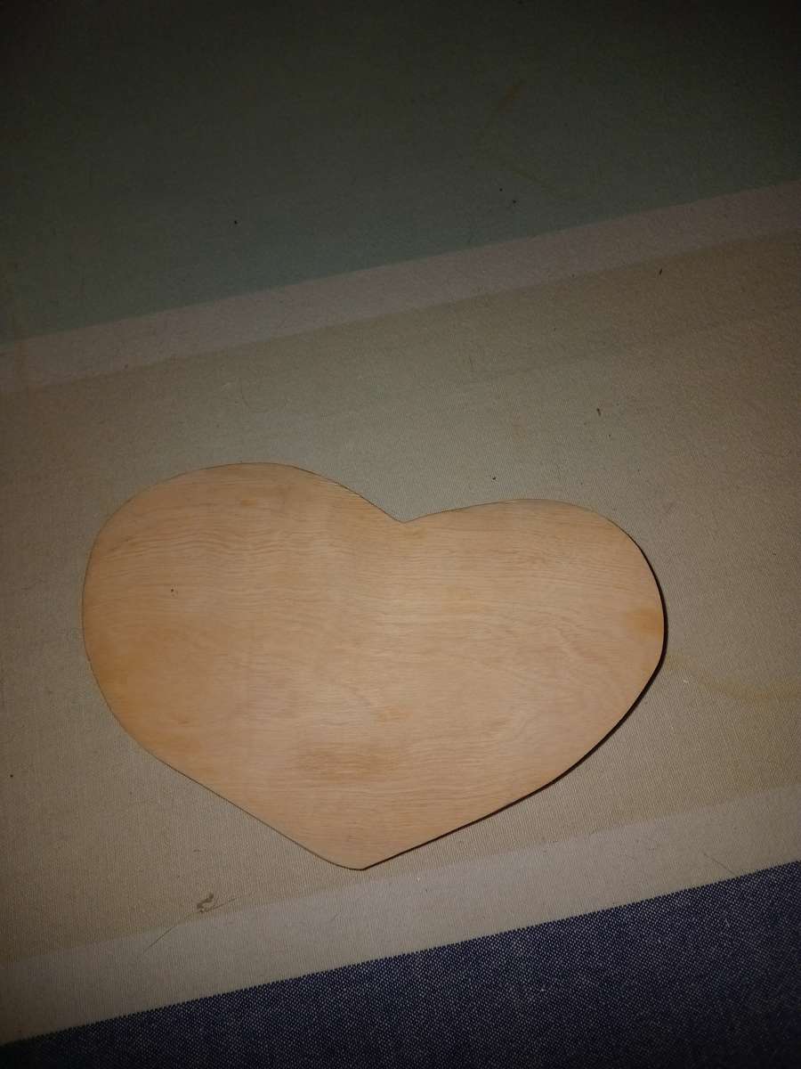 Carved wooden heart door stop