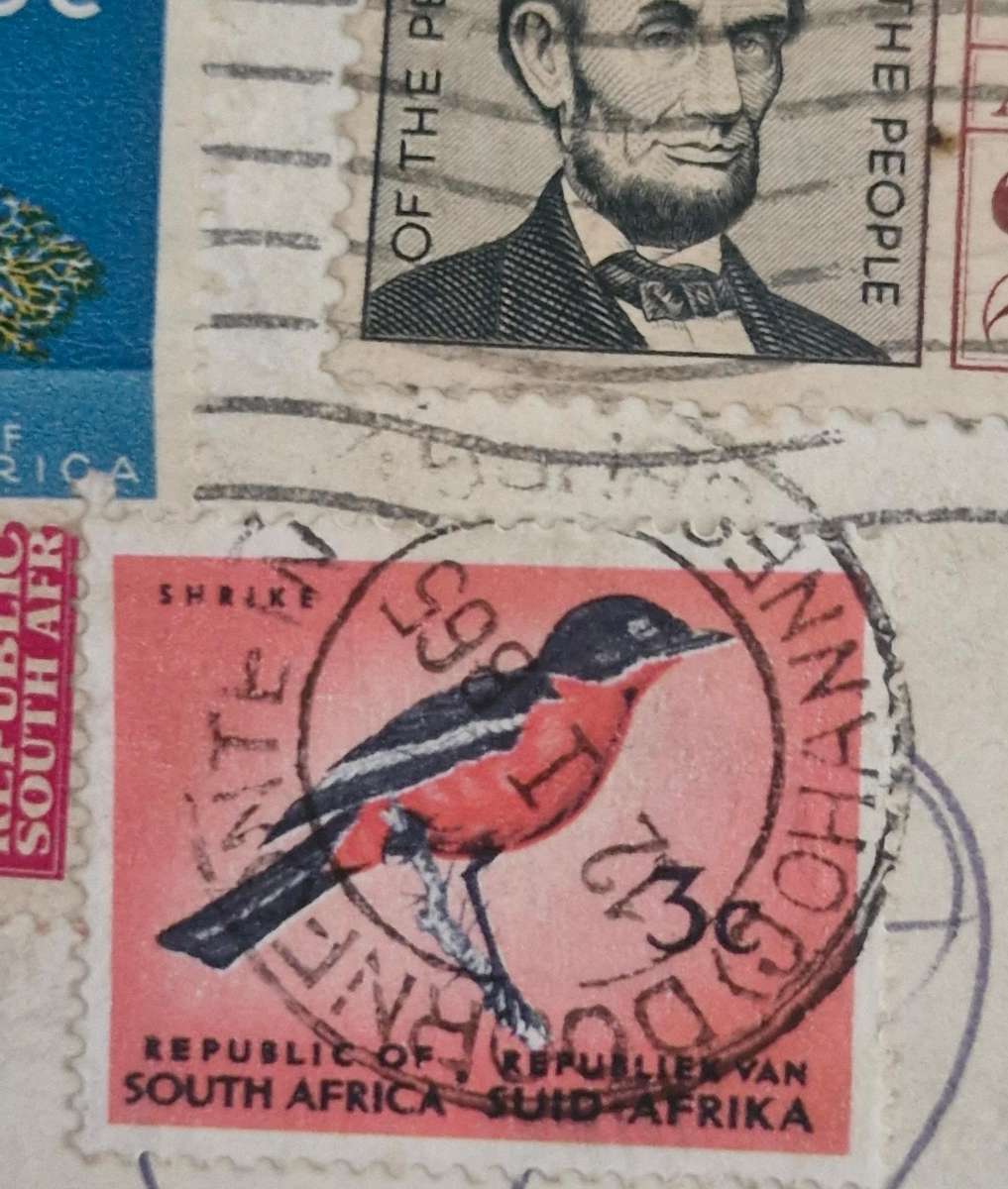 Stamps with 4 different cancellations- USAirmail, South African Postage, & SA postage due stamp