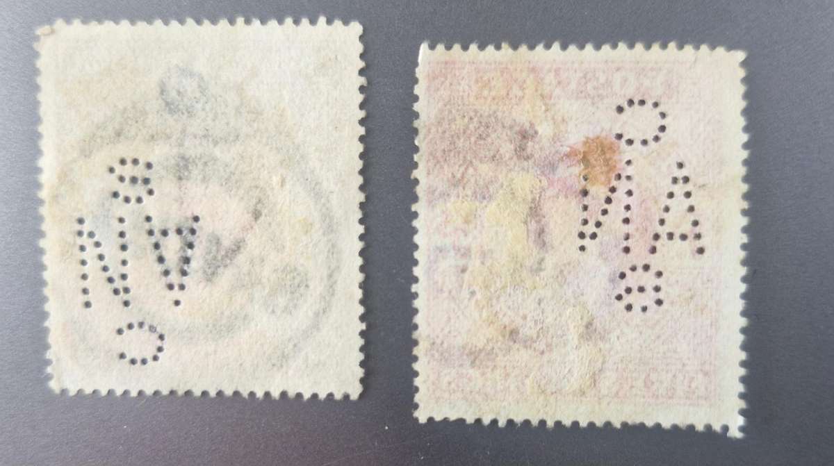 British 1902 2/6 shilling and 1902 5 shilling stamps with same perfin and cancellation stamp