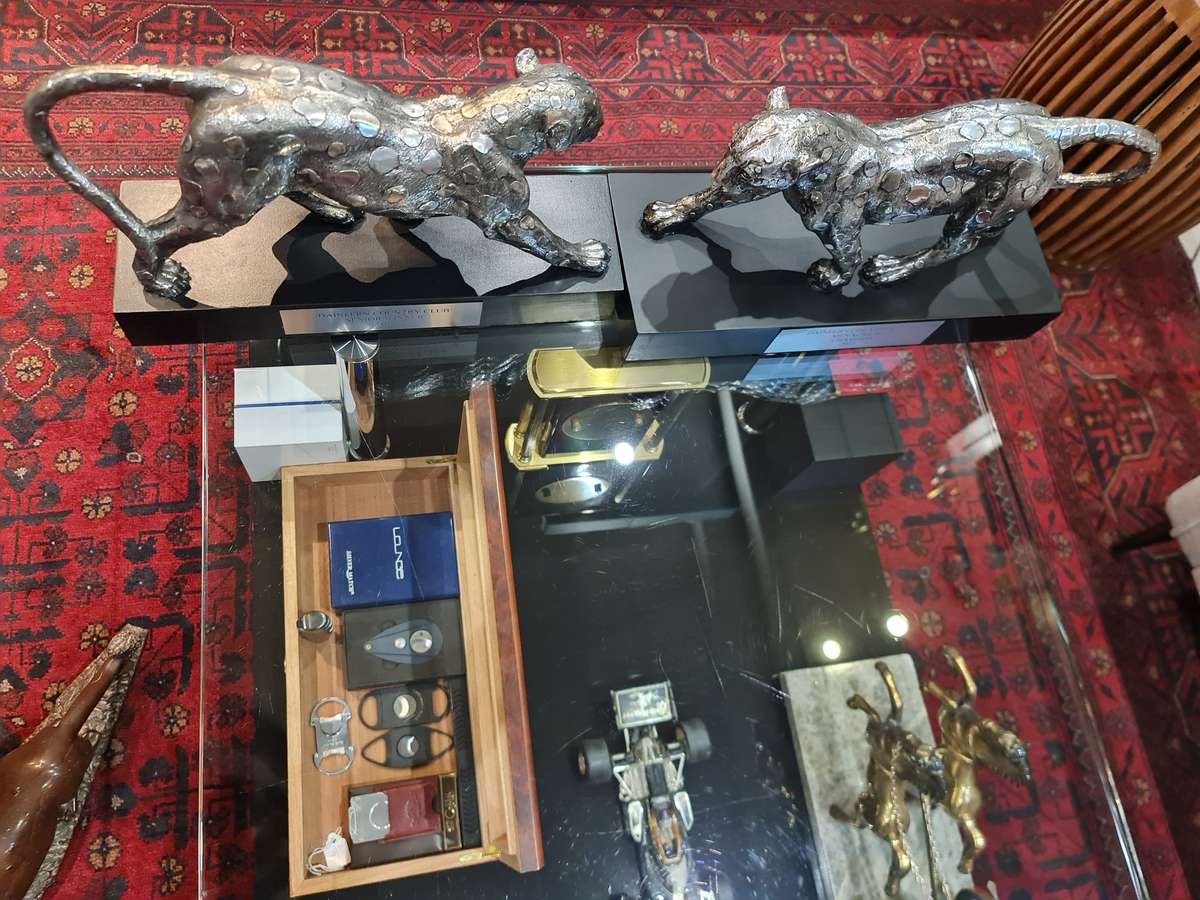 Silver Stalking Leopards  on Wooden Base