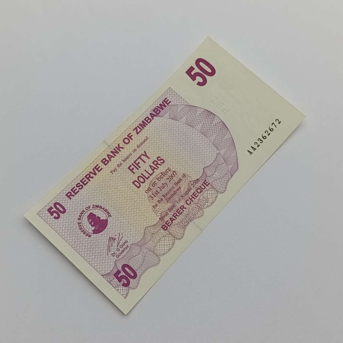 Zimbabwe $50 Bearer cheques issued 1 Aug 2006 Pair of AA numbered uncirculated notes
