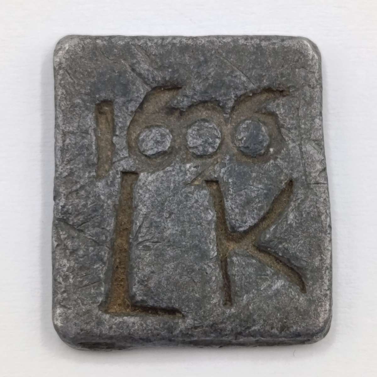 1606 Communion token imprinted 1606 LK