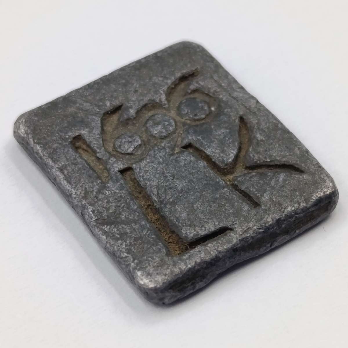 1606 Communion token imprinted 1606 LK