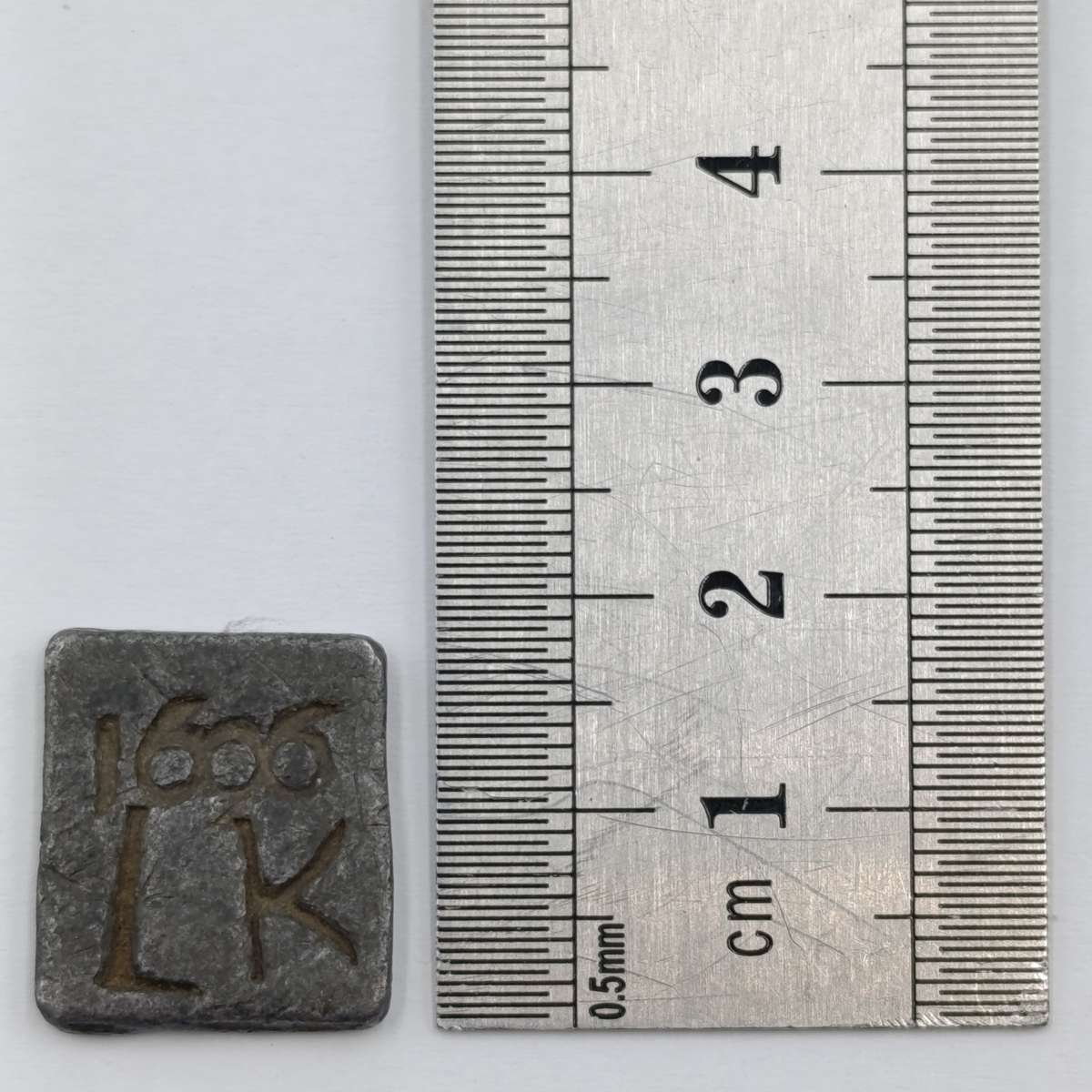 1606 Communion token imprinted 1606 LK