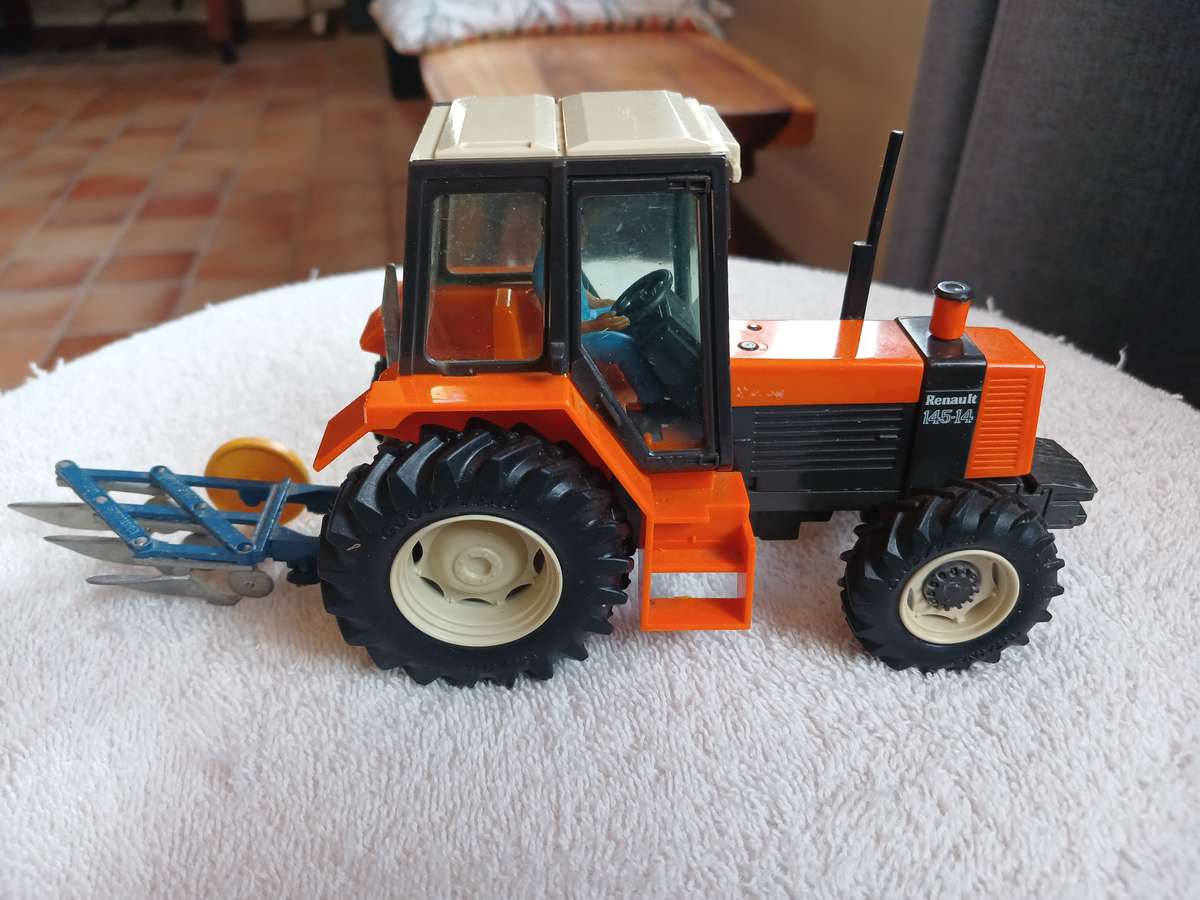 Britains 1985 Renault 145-14 tractor with Britains plough