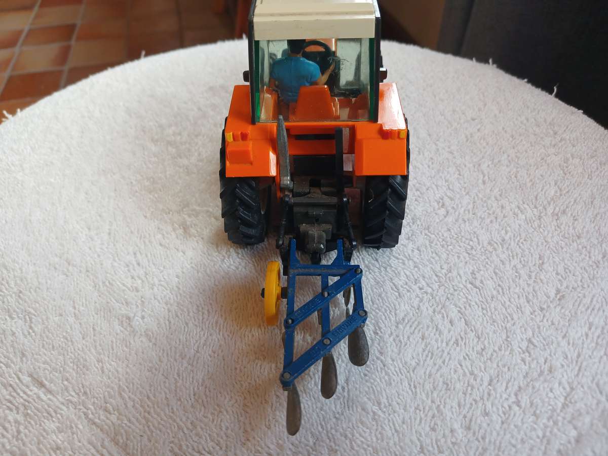 Britains 1985 Renault 145-14 tractor with Britains plough
