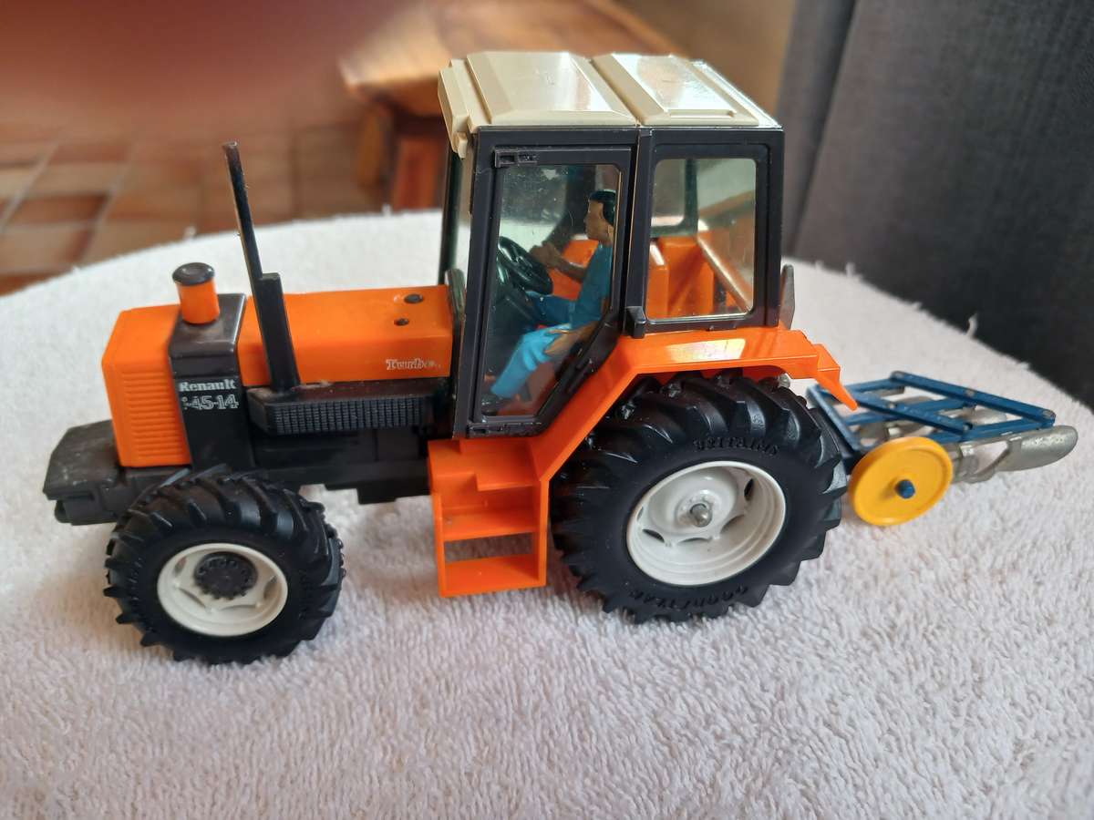 Britains 1985 Renault 145-14 tractor with Britains plough