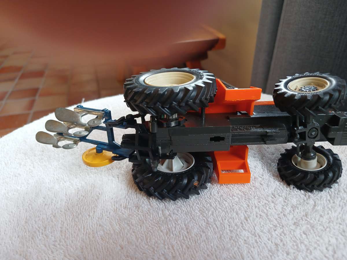 Britains 1985 Renault 145-14 tractor with Britains plough