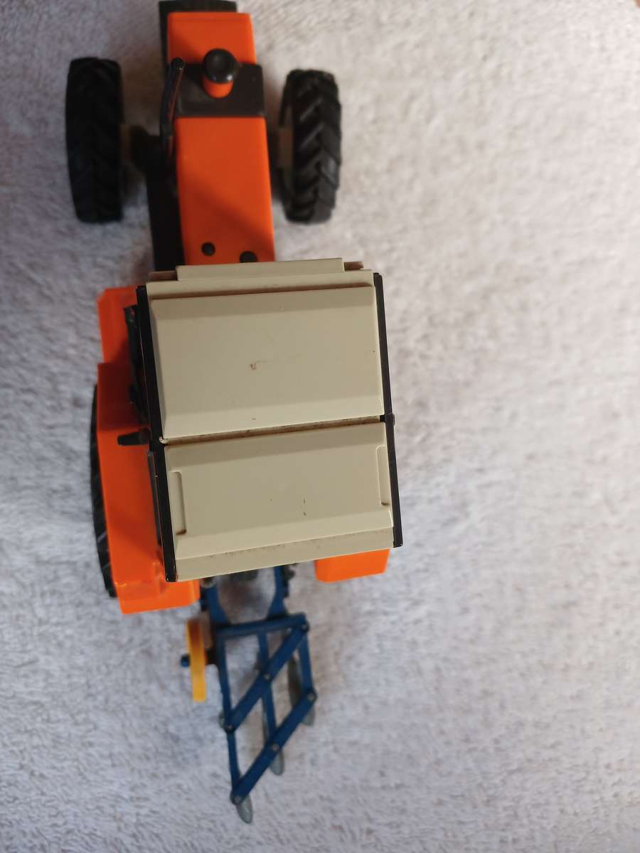 Britains 1985 Renault 145-14 tractor with Britains plough