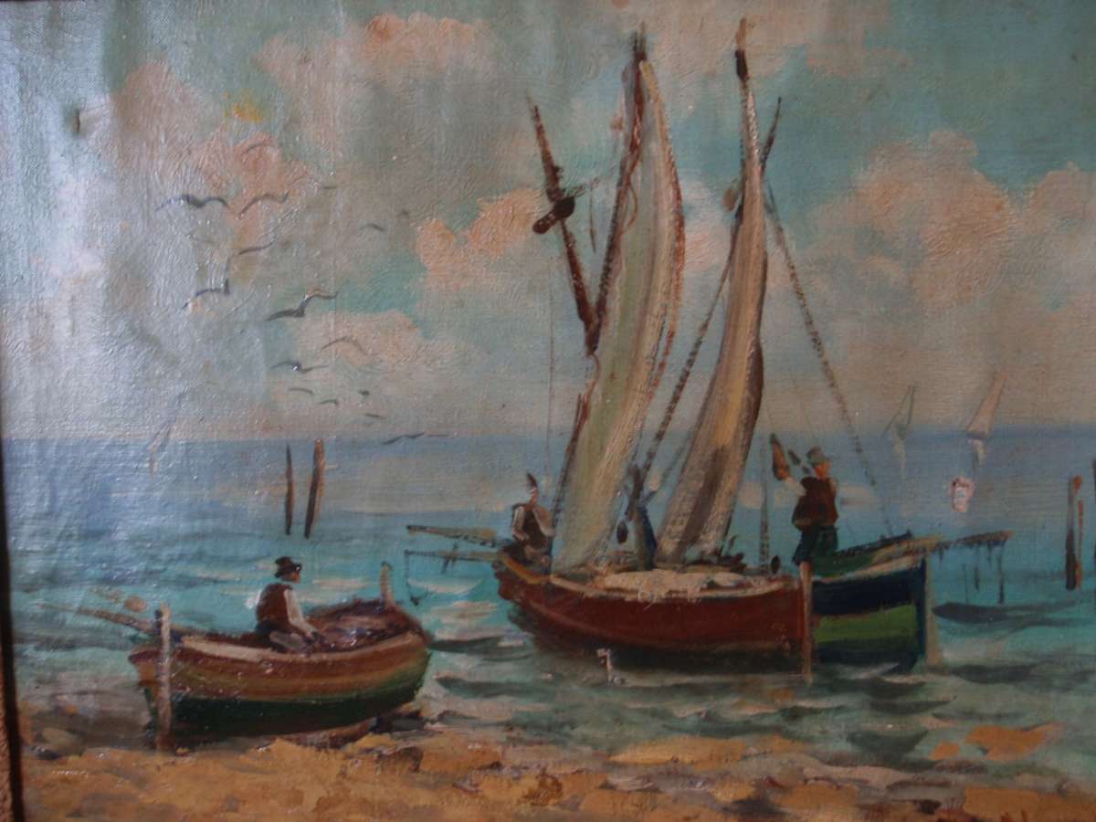Antique original oil painting on canvas. Fishing boats on beach. In original frame. Charming piece.