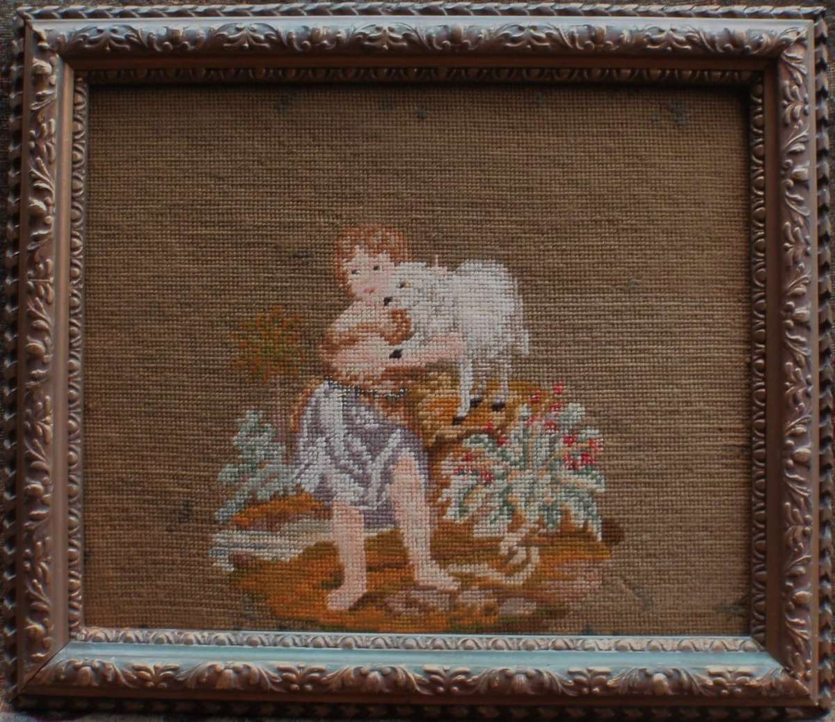 Vintage tapestry. Beautiful old image of a Child with a Lamb. Original ornate frame. Muted and moody