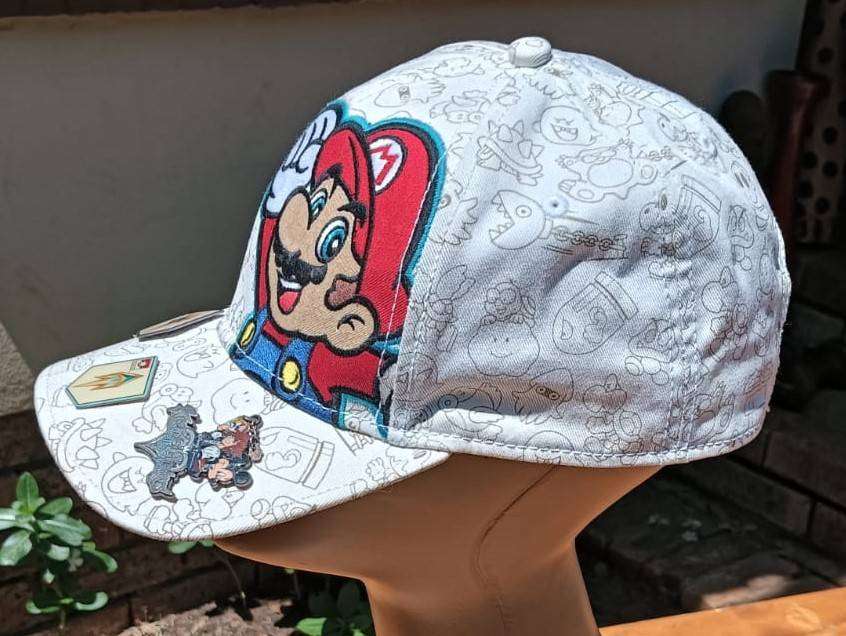 Super Mario Brothers Nintendo 2012 Snapback Cap with 2 pinned Pokemon League Gym Badges