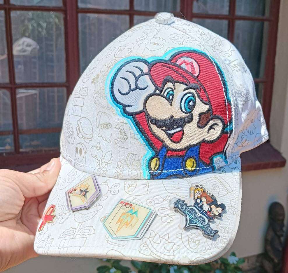 Super Mario Brothers Nintendo 2012 Snapback Cap with 2 pinned Pokemon League Gym Badges