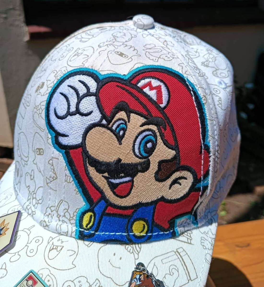 Super Mario Brothers Nintendo 2012 Snapback Cap with 2 pinned Pokemon League Gym Badges