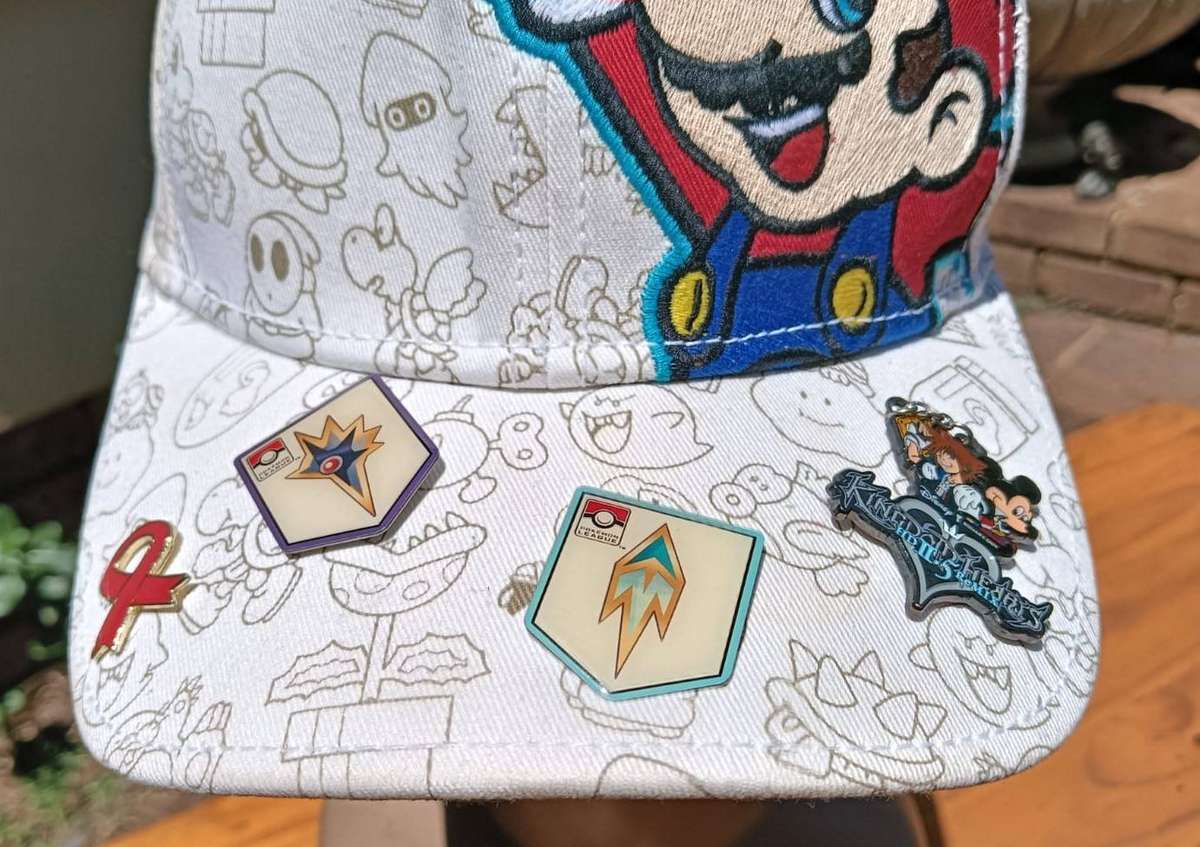 Super Mario Brothers Nintendo 2012 Snapback Cap with 2 pinned Pokemon League Gym Badges