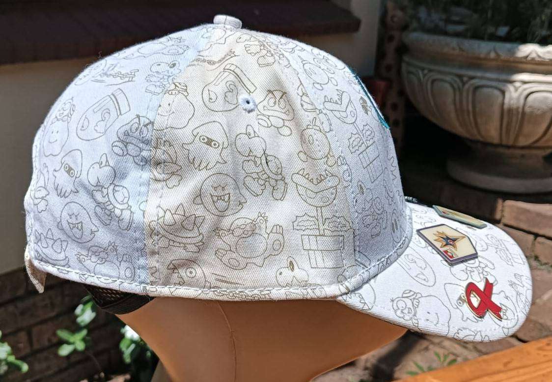 Super Mario Brothers Nintendo 2012 Snapback Cap with 2 pinned Pokemon League Gym Badges