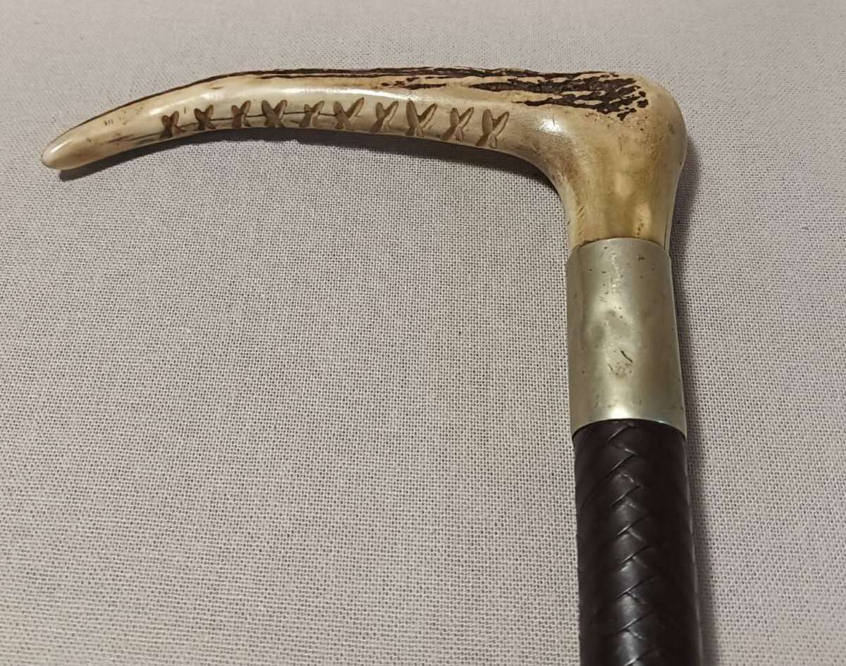 Two Antique Leather and Bone Handle Hunting Crops one with a Gloria Kerschot Silver Metal Collar