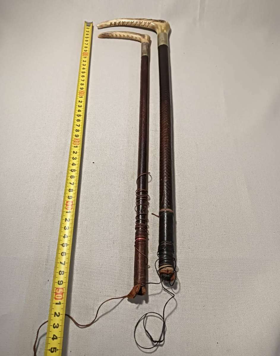 Two Antique Leather and Bone Handle Hunting Crops one with a Gloria Kerschot Silver Metal Collar