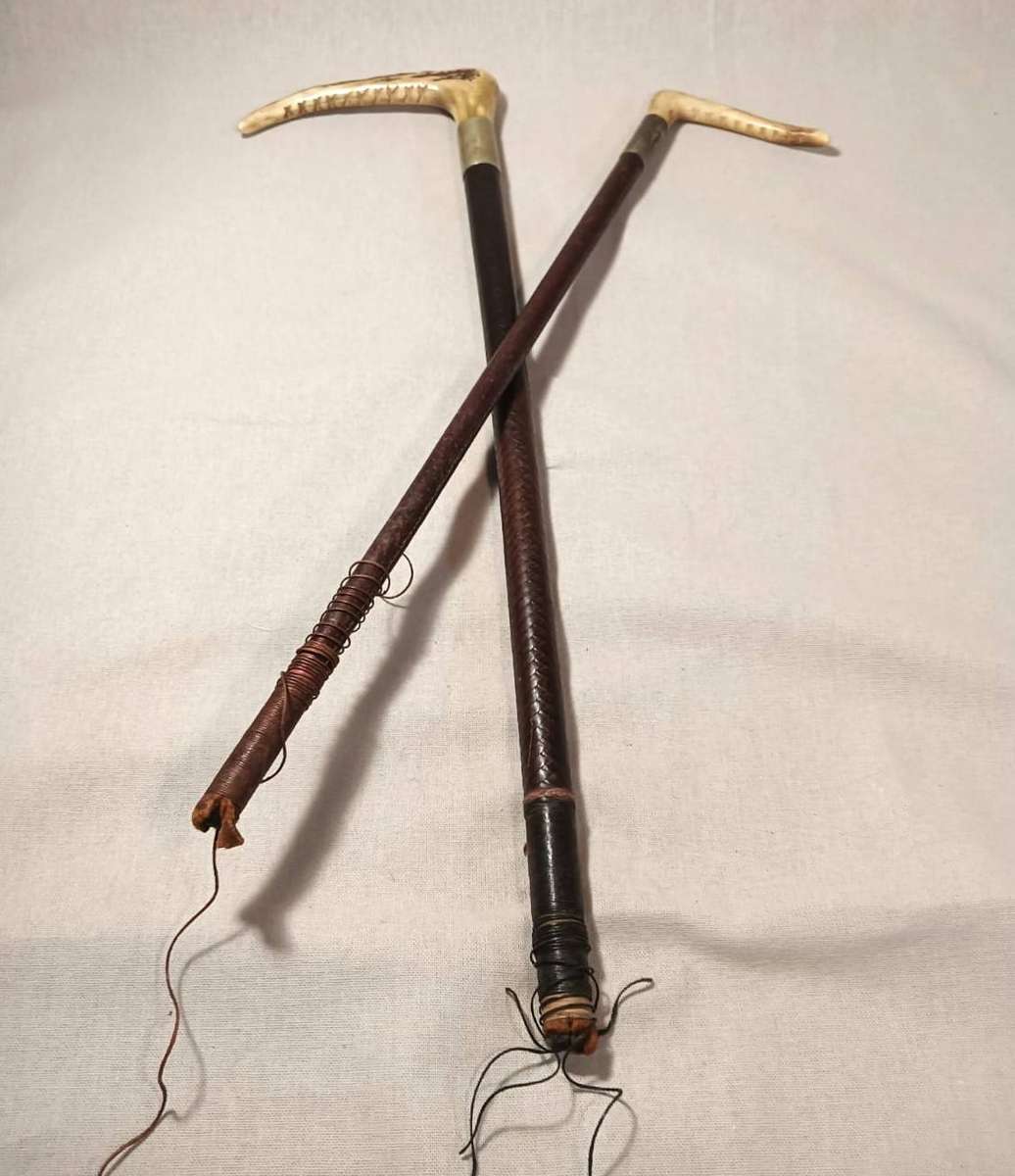 Two Antique Leather and Bone Handle Hunting Crops one with a Gloria Kerschot Silver Metal Collar