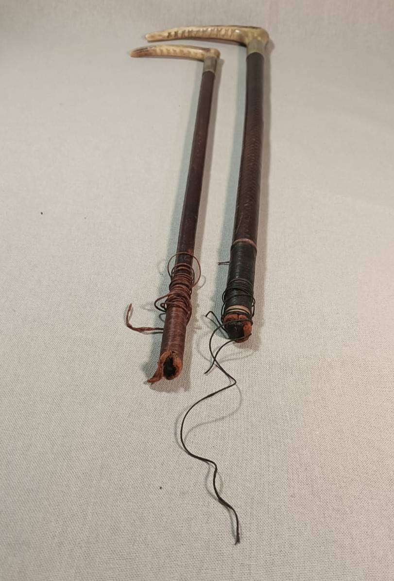 Two Antique Leather and Bone Handle Hunting Crops one with a Gloria Kerschot Silver Metal Collar