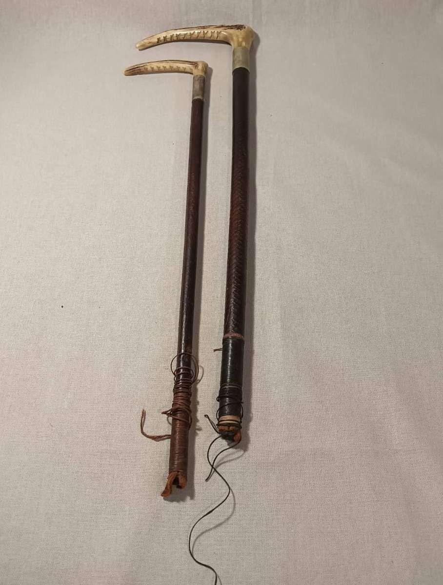 Two Antique Leather and Bone Handle Hunting Crops one with a Gloria Kerschot Silver Metal Collar