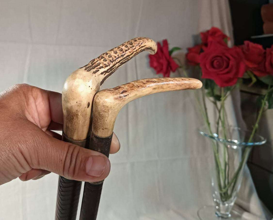 Two Antique Leather and Bone Handle Hunting Crops one with a Gloria Kerschot Silver Metal Collar