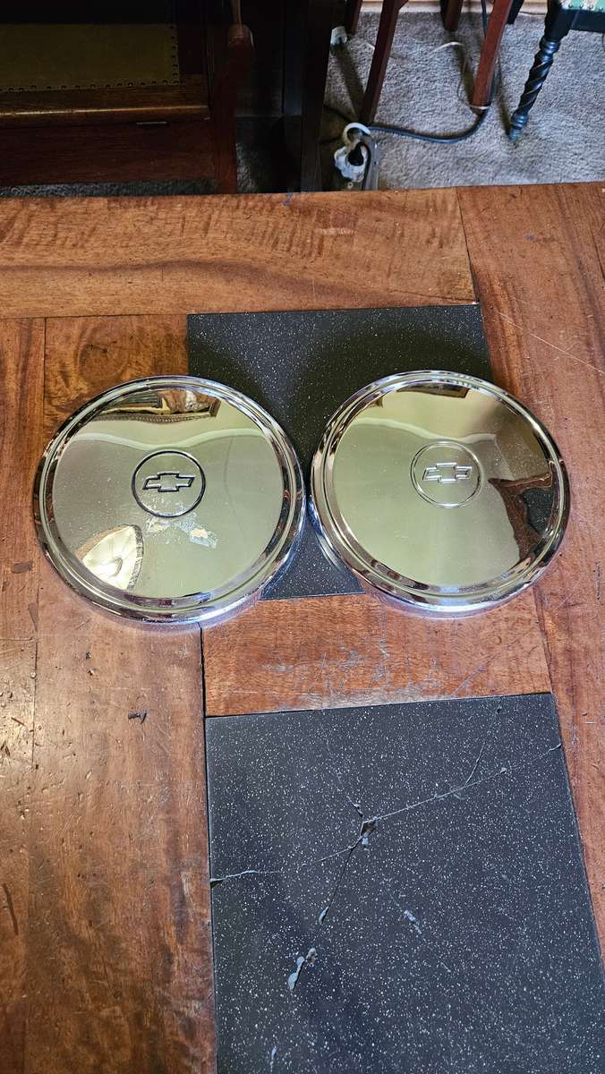 Two Vintage Chevrolet Hub Caps