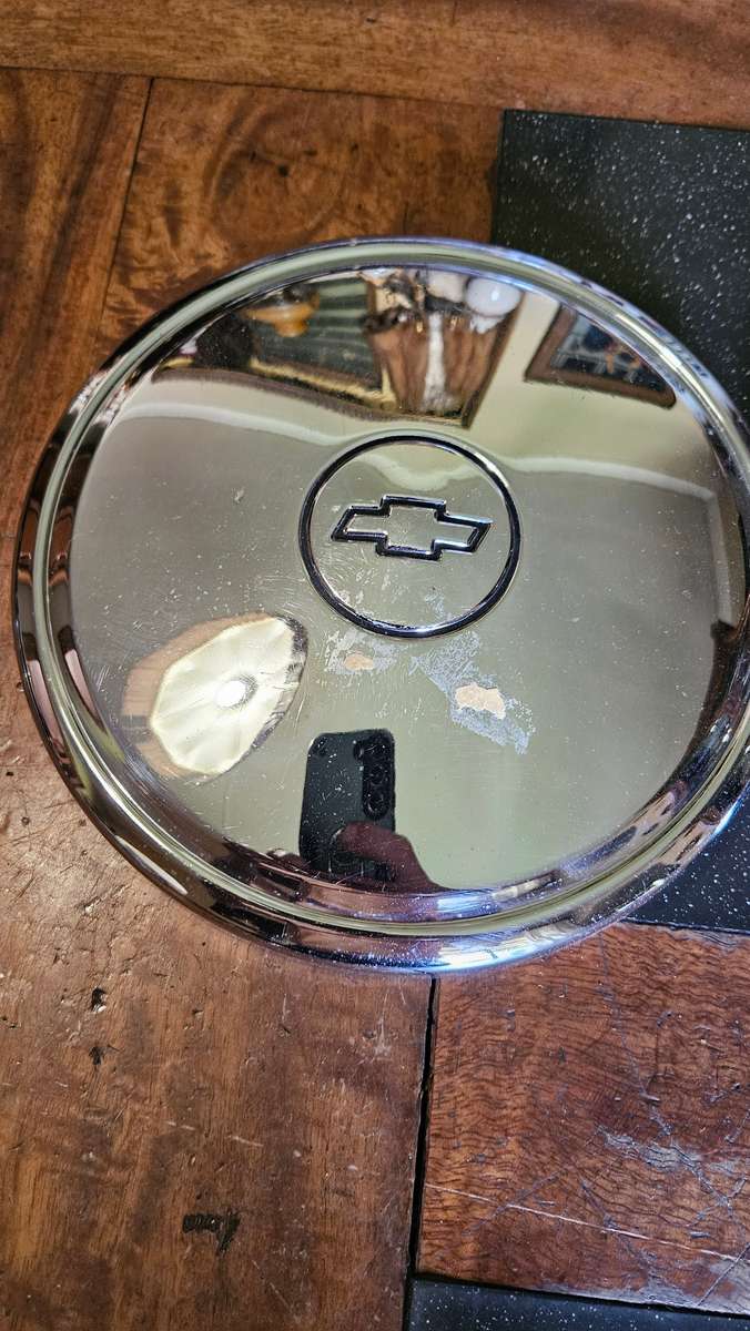 Two Vintage Chevrolet Hub Caps