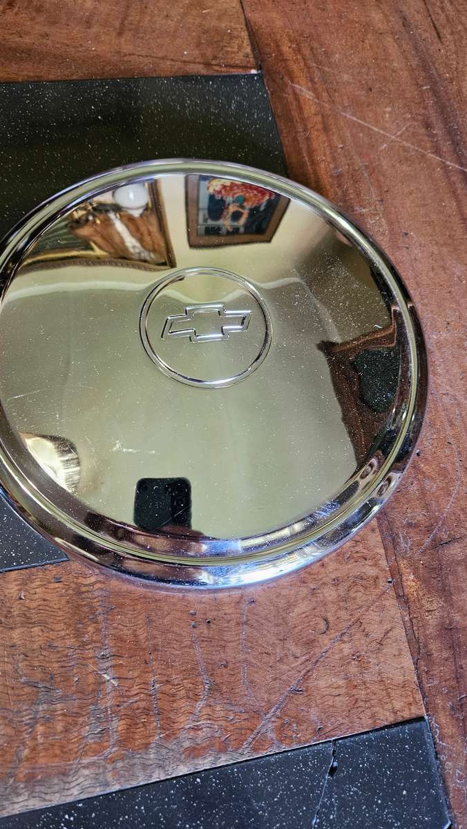Two Vintage Chevrolet Hub Caps