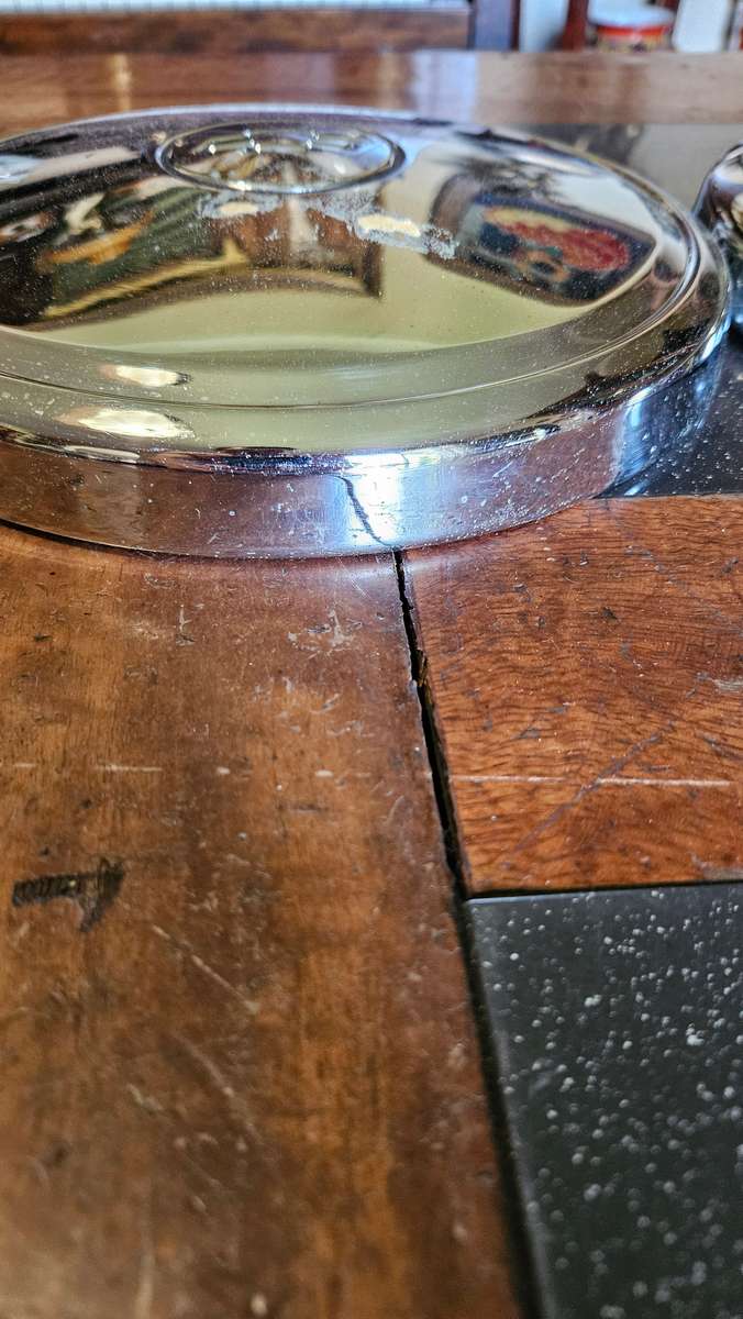 Two Vintage Chevrolet Hub Caps