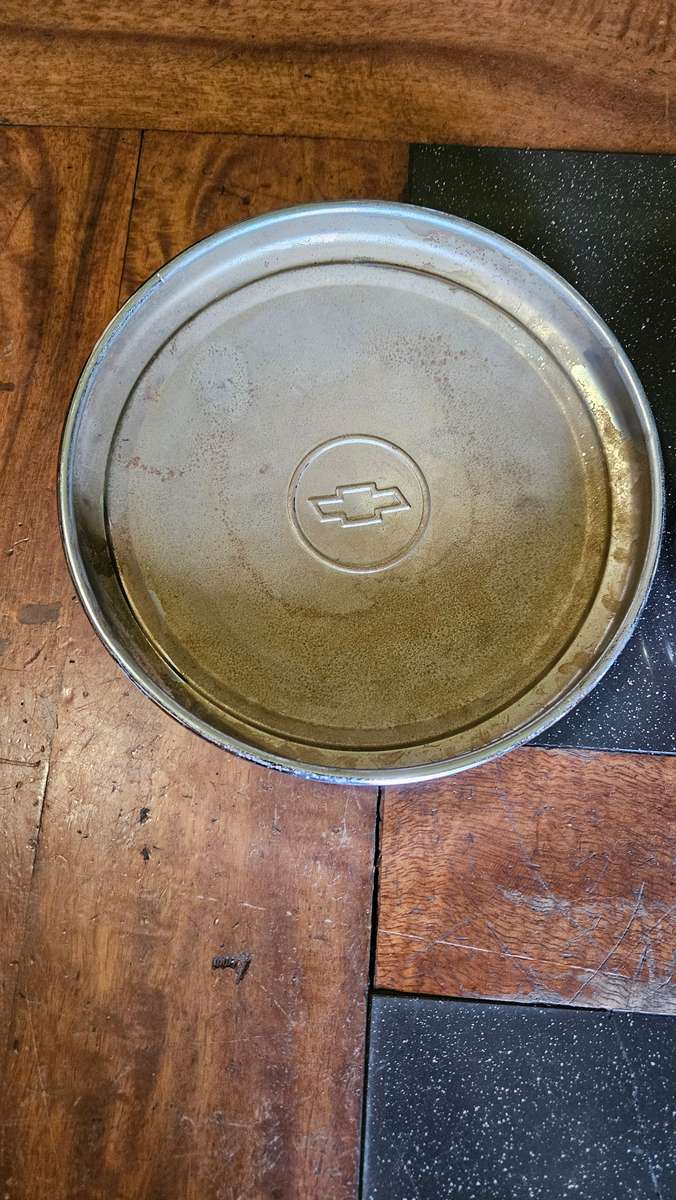 Two Vintage Chevrolet Hub Caps