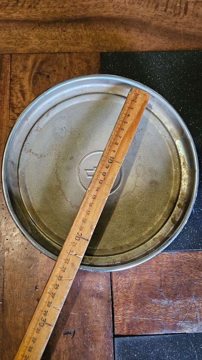 Two Vintage Chevrolet Hub Caps