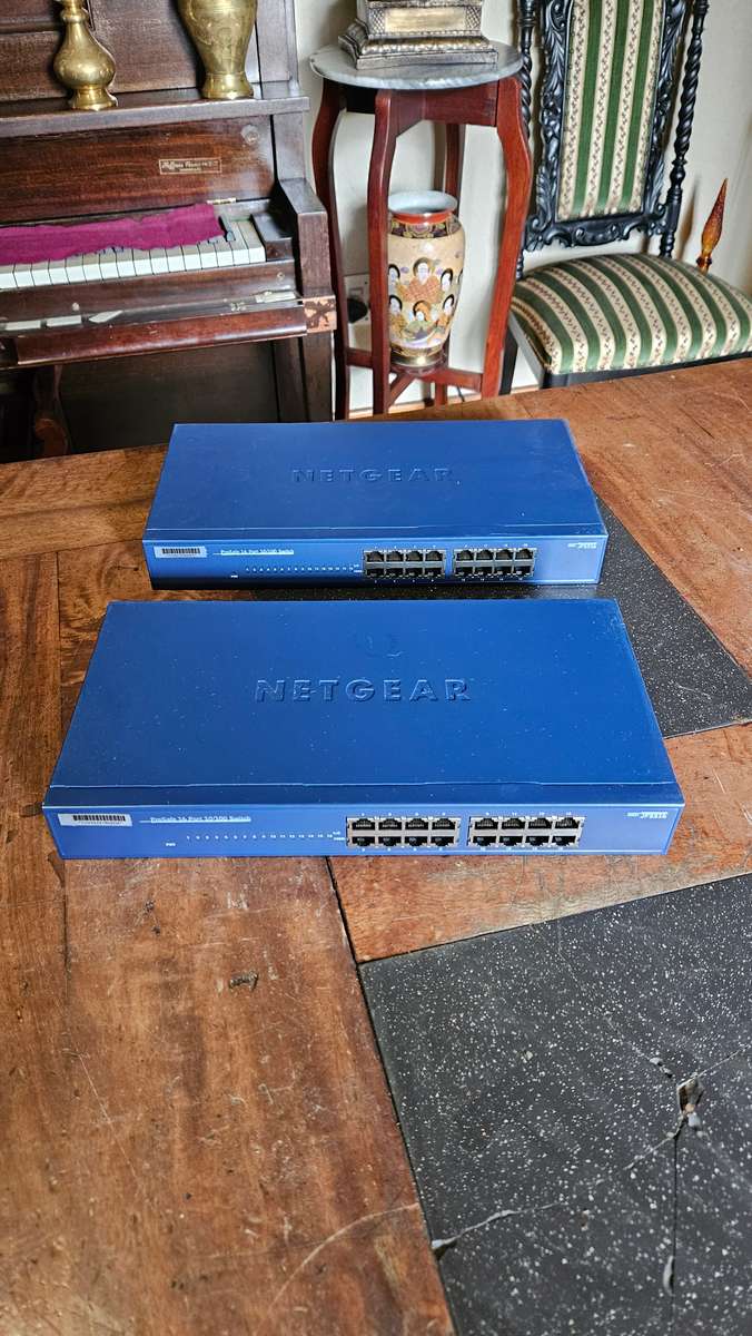 2 X NETGEAR Prosafe 16 Port 10/100 Switch. "Unused"