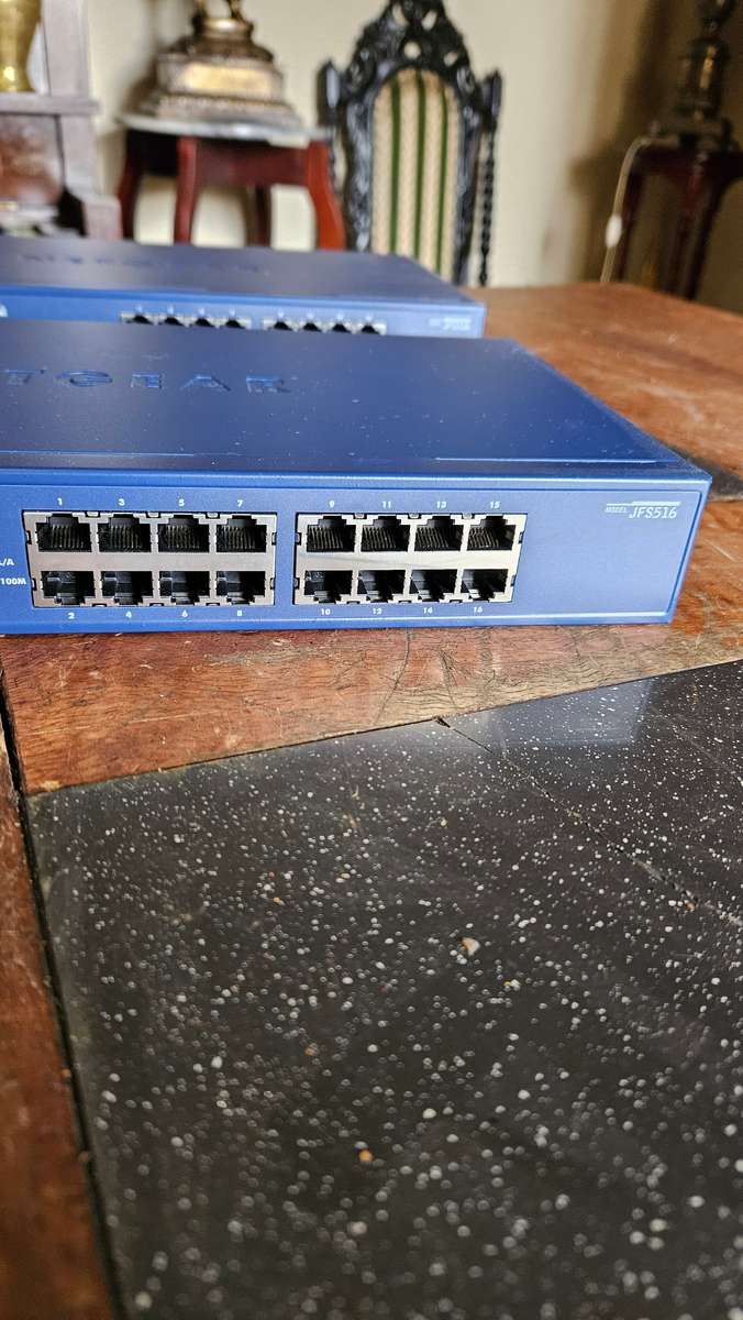 2 X NETGEAR Prosafe 16 Port 10/100 Switch. "Unused"