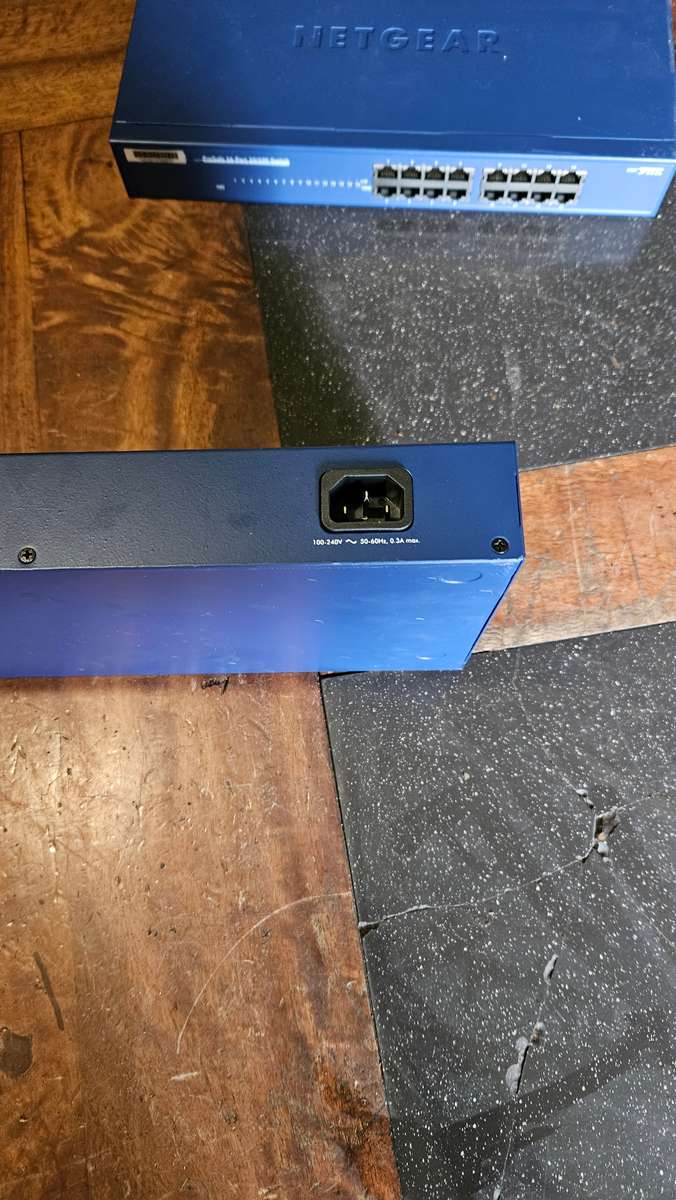 2 X NETGEAR Prosafe 16 Port 10/100 Switch. "Unused"