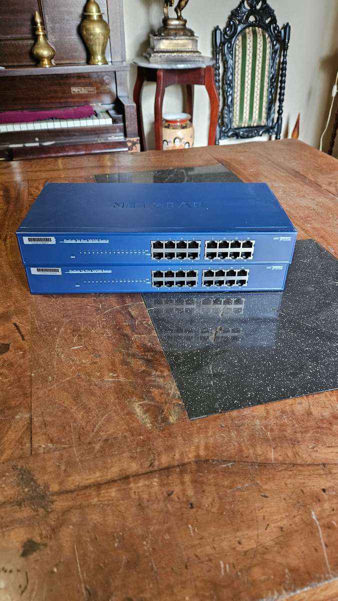 2 X NETGEAR Prosafe 16 Port 10/100 Switch. "Unused"