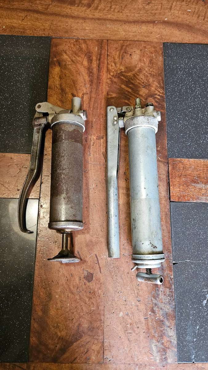 Two Manual Greas Guns