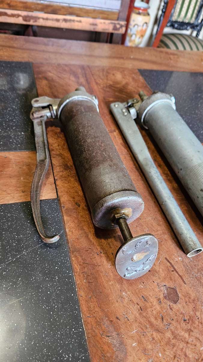 Two Manual Greas Guns