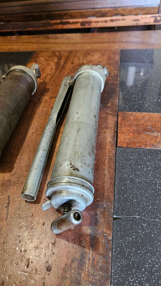 Two Manual Greas Guns