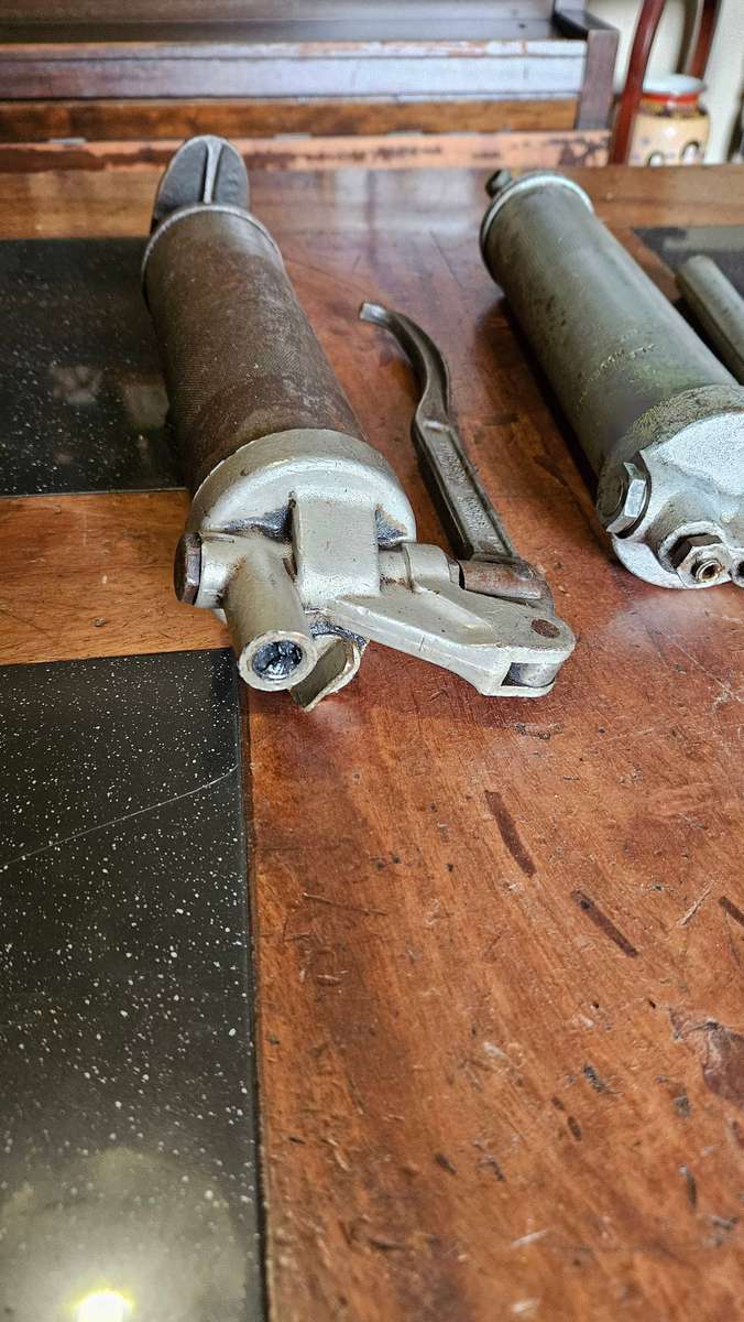 Two Manual Greas Guns