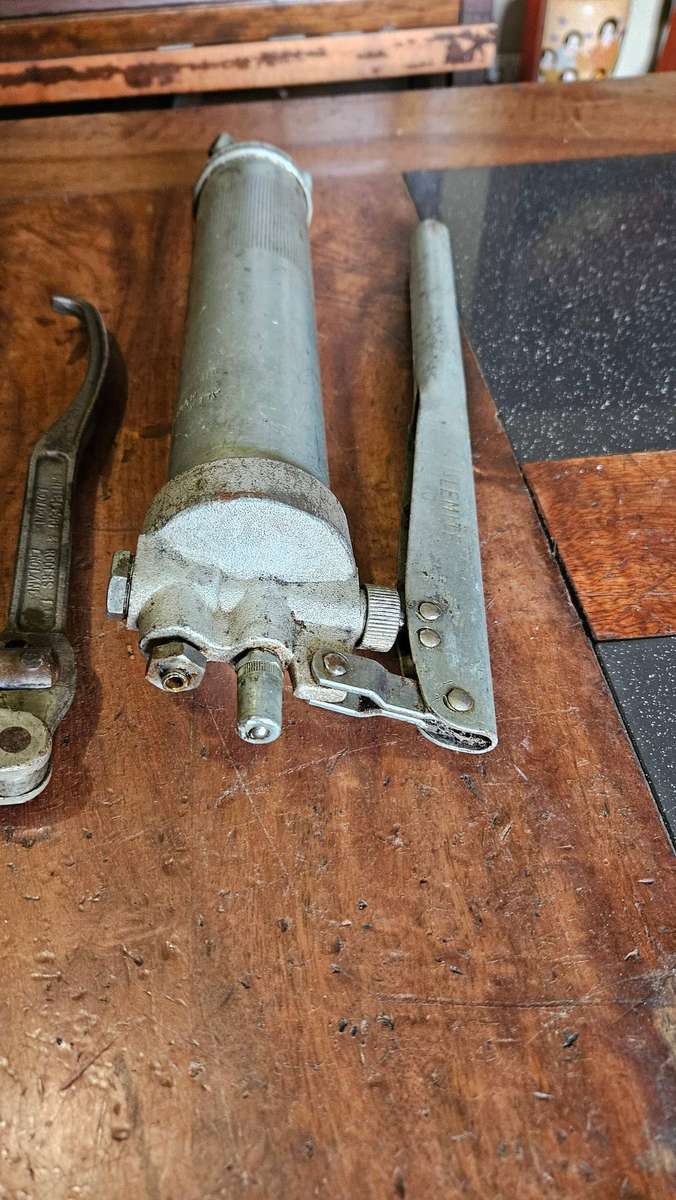 Two Manual Greas Guns