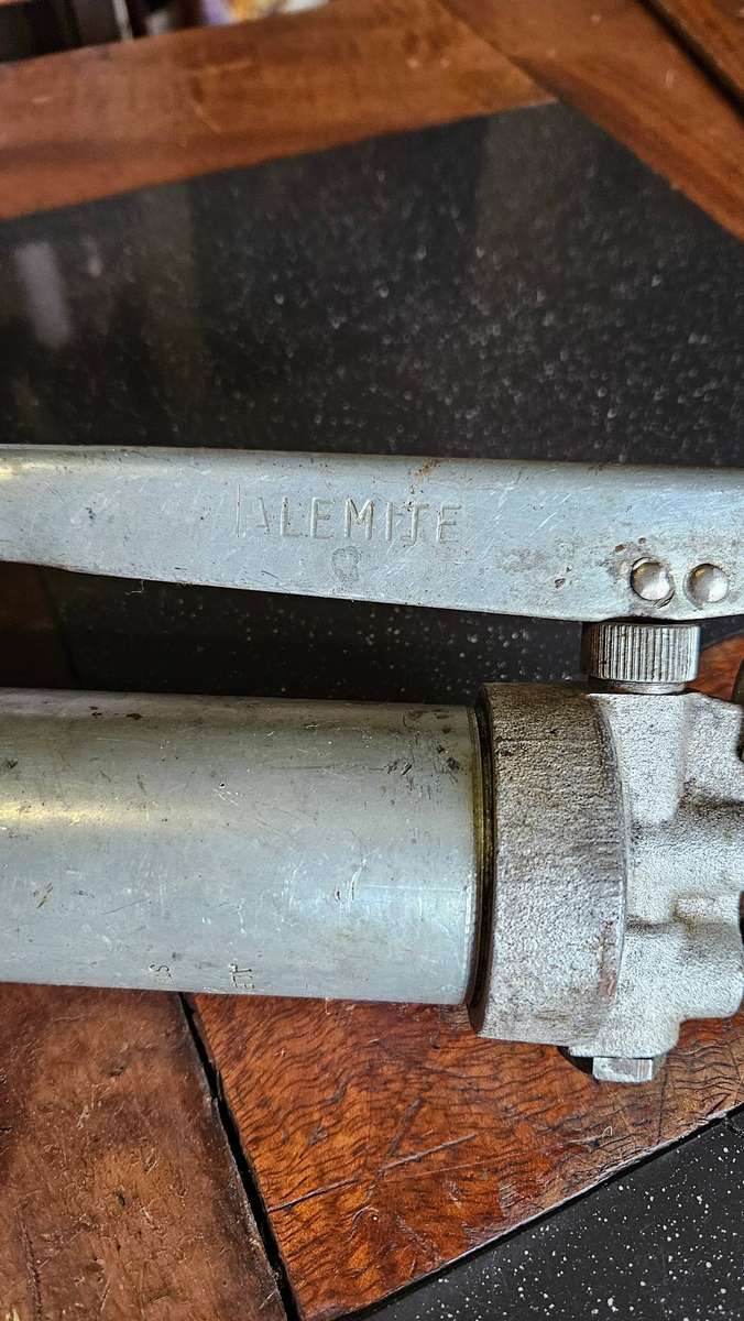 Two Manual Greas Guns