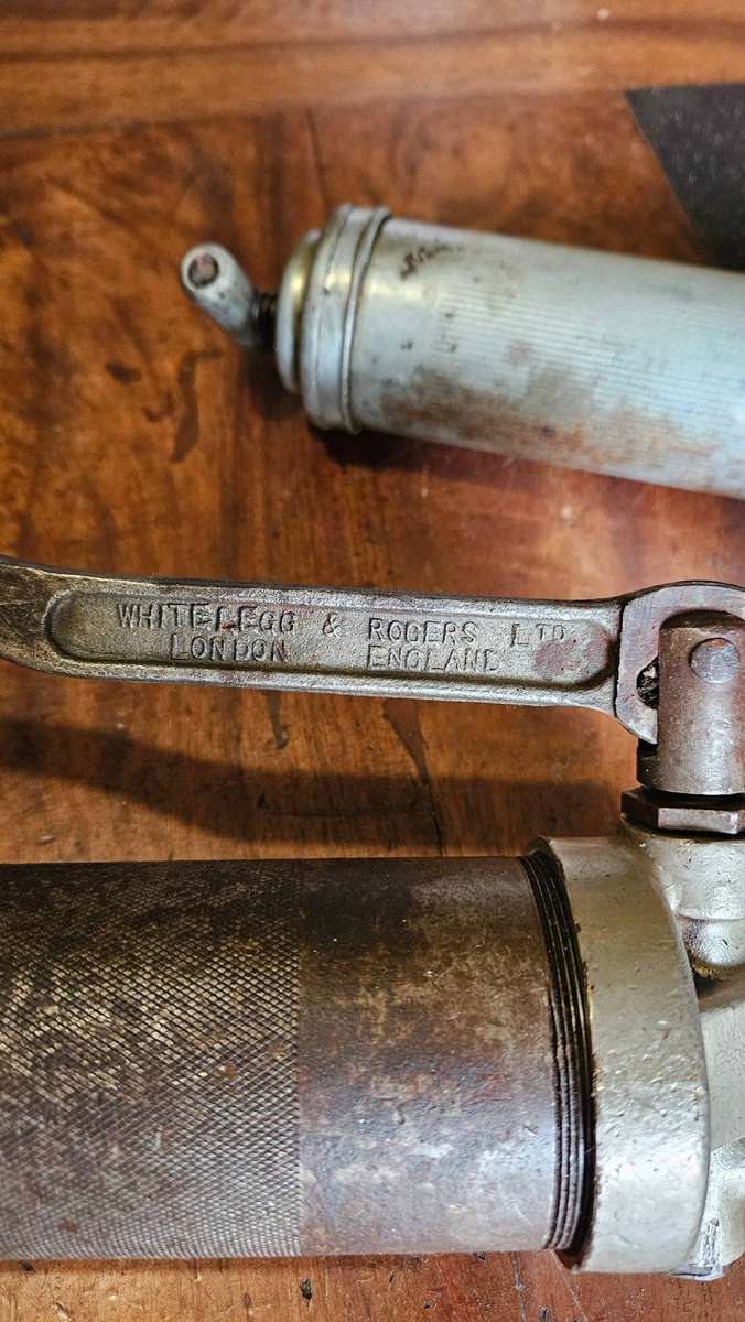 Two Manual Greas Guns