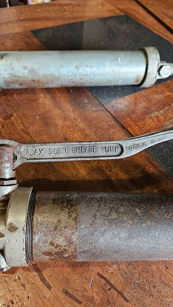 Two Manual Greas Guns