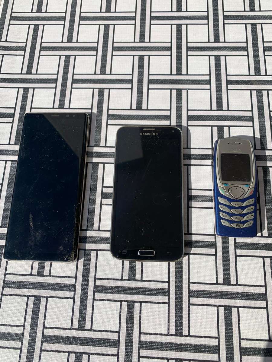 Samsung Galaxy Note 8 with 2 other phones
